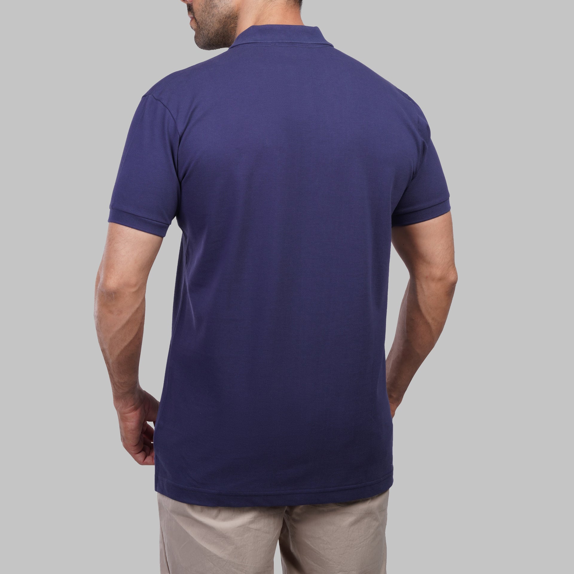 Shop classic fit pique indigo polo shirt for men summer 2026 by Dockland - تسوق قميص بولو بيكيه رجالي كلاسيك انديجو ازرق نيلي صيفي 2026 من دوكلاند - ملابس رجالي كاجوال صيفي